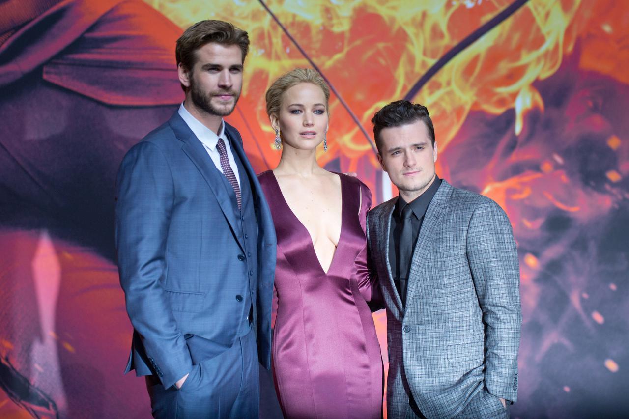 Actors Liam Hemsworth (l-r), Jennifer Lawrence and Josh Hutcherson at the world premiere of The Hunger Games: Mockingjay Part 2 at the Cinestar cinema in Berlin, Germany, 4 November 2015. Photo: JOERG CARSTENSEN/DPA/DPA/PIXSELL