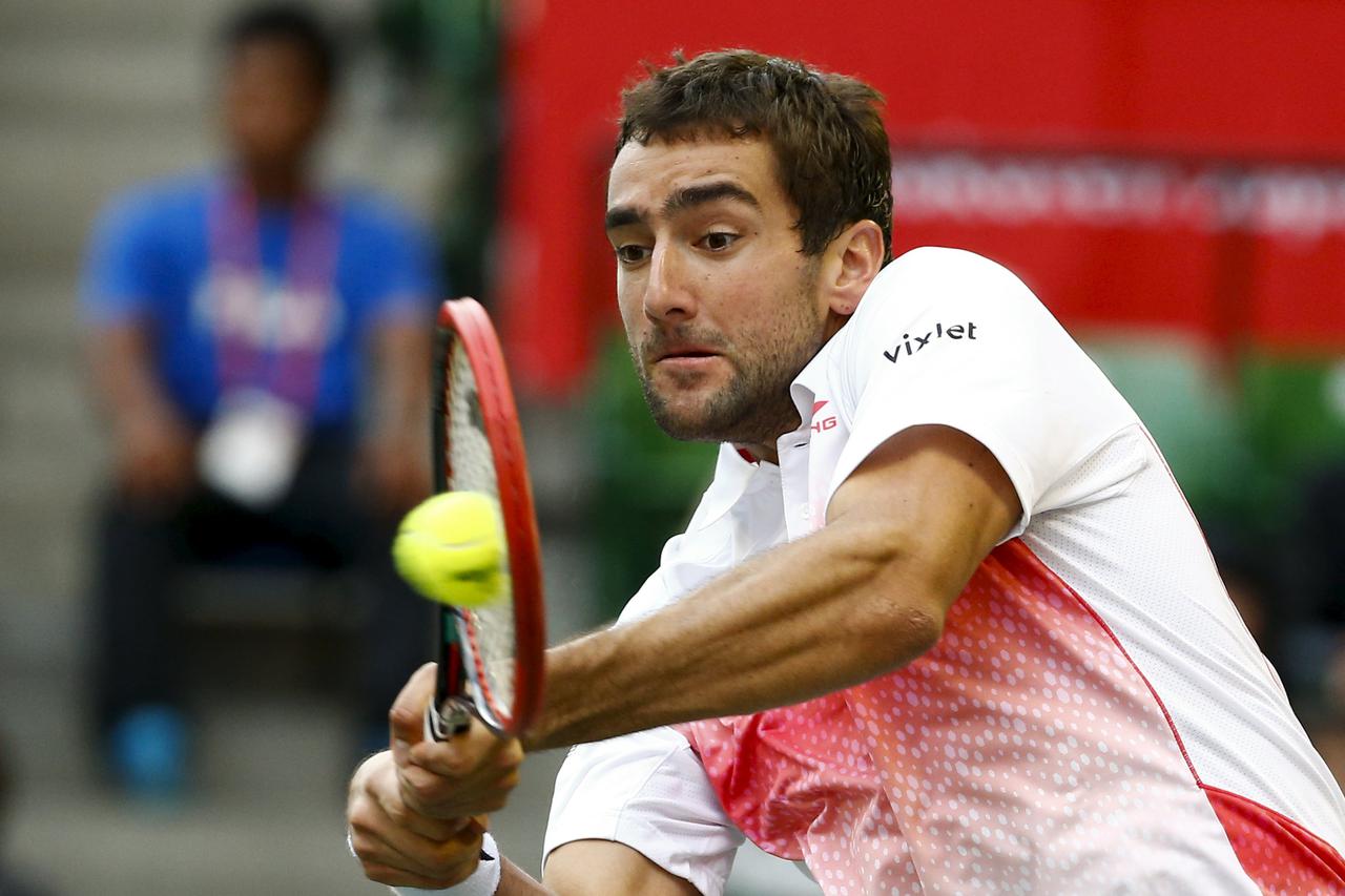 Marin Cilic of Croatia returns the ball to Japan's Kei Nishikori during their men's singles tennis match at the Japan Open championships in Tokyo October 9, 2015.   REUTERS/Thomas Peter