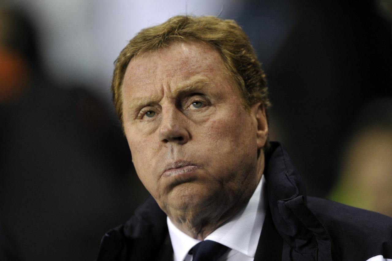 \'Tottenham Hotspur\'s manager Harry Redknapp reacts before their Champions League soccer match against AC Milan at White Hart Lane in London March 9, 2011.    REUTERS/Dylan Martinez (BRITAIN - Tags: 