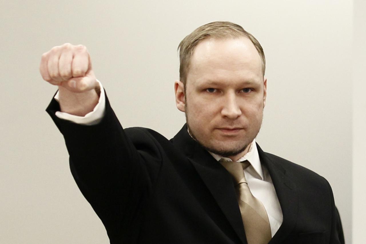 'Anders Behring Breivik clenches his fist as he arrives at the courtroom for the first day of his trial  in Oslo in this April 16, 2012 file photograph. As the trial of Breivik comes to an end, Norway