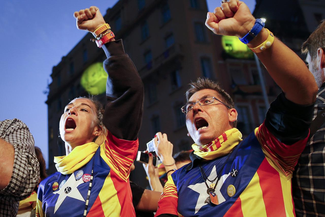 Junts Pel Si (Together For Yes) supporters wear  pro-independence 