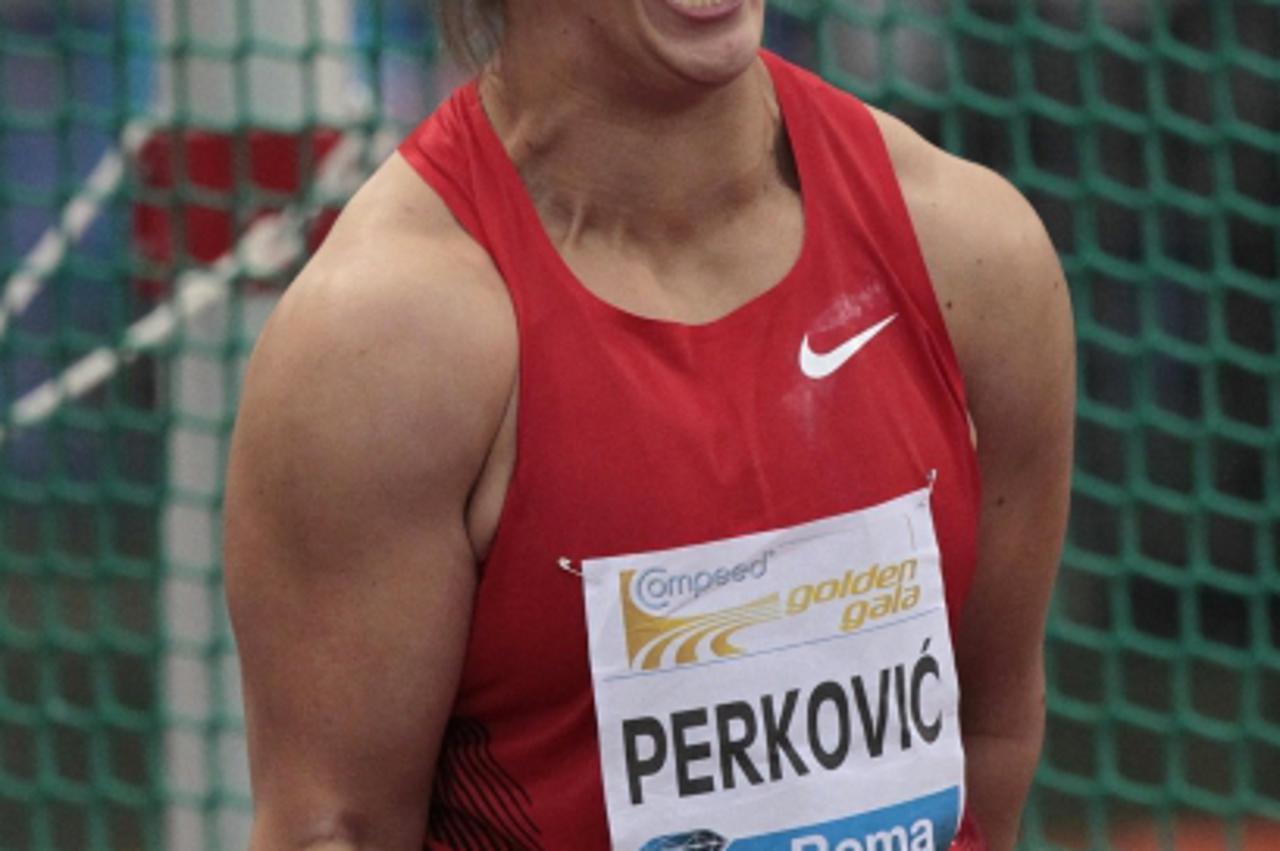 'Sandra Perkovic of Croatia reacts as she competes in the women\'s discus event at the Golden Gala IAAF Diamond League at the Olympic stadium in Rome May 26, 2011. REUTERS/Alessandro Bianchi  (ITALY -