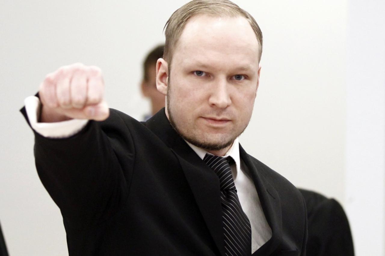 'Defendant Anders Behring Breivik gestures at the start of the third day of proceedings in the courthouse in Oslo April 18, 2012.  REUTERS/Lise Aserud/Scanpix Norway/Pool (NORWAY - Tags: CRIME LAW SOC