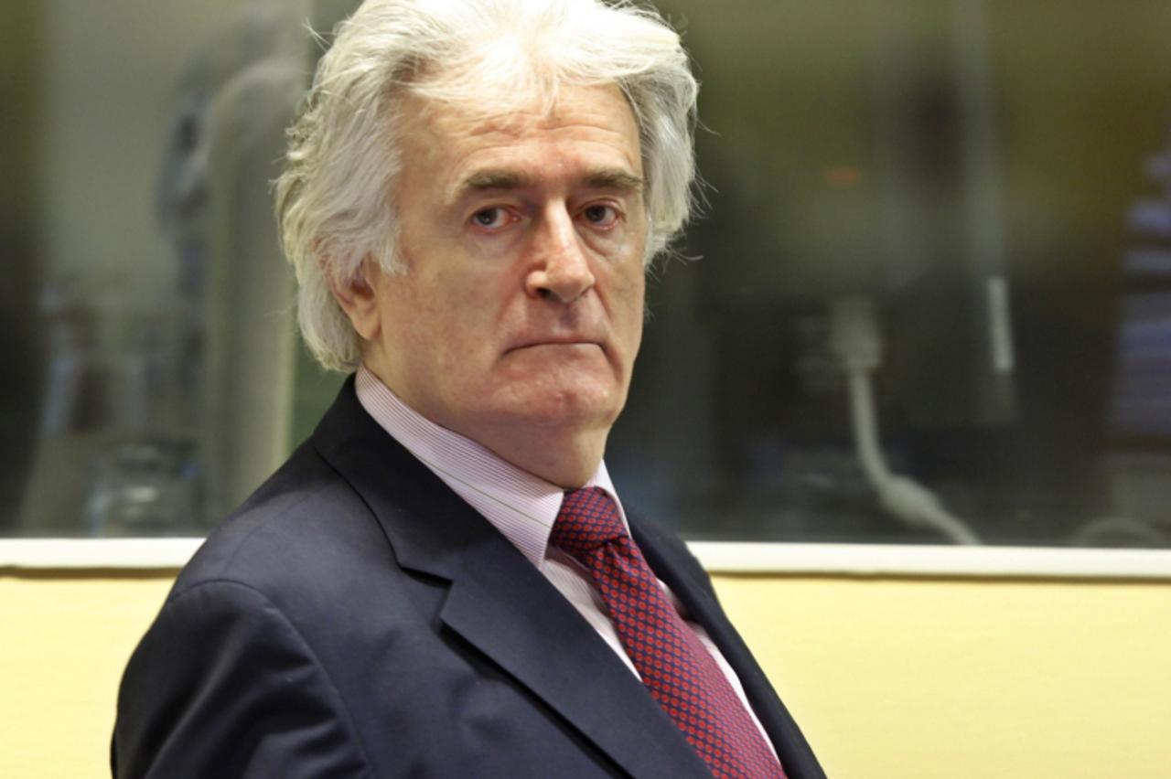 'A picture taken on November 3, 2009 shows Former Bosnian Serb leader Radovan Karadzic in the courtroom of the ICTY War Crimes tribunal in the Hague. Prosecutors wind up their case in the genocide tri