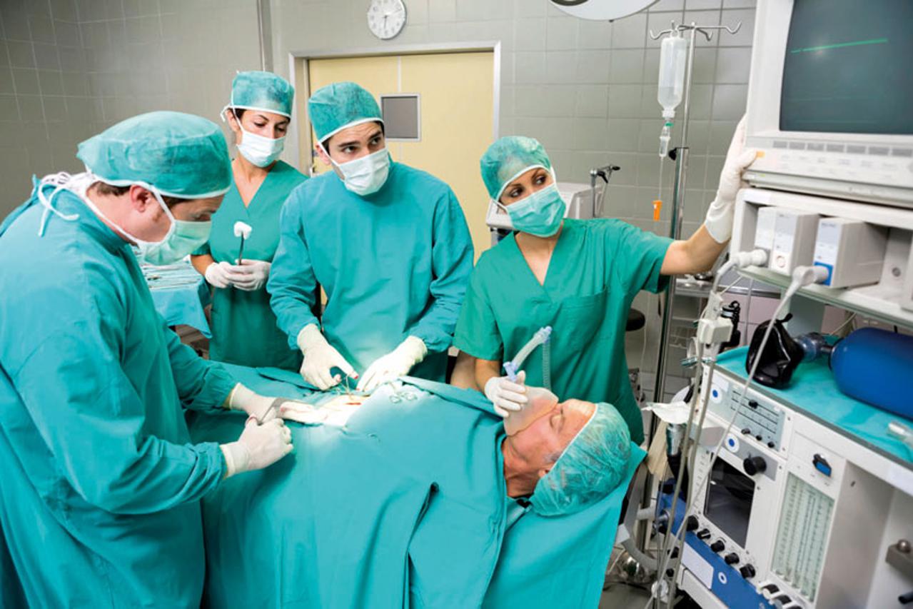 Surgeon looking at a monitor while operating