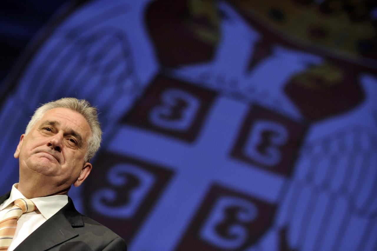 'Serbian presidential candidate and leader of the Serbian Progressive Party (SNS) Tomislav Nikolic looks on during a final pre-election convention in Belgrade on May 15, 2012. On May 20, Serbia votes 