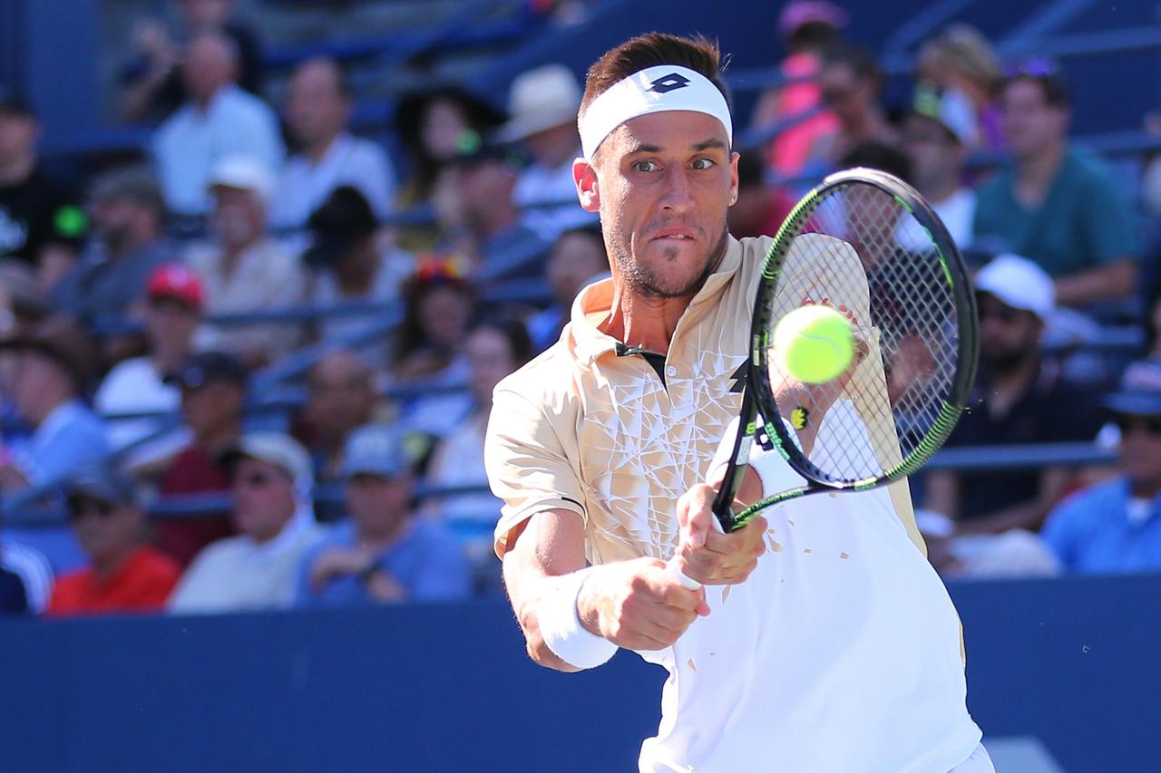 Aug 30, 2016; New York, NY, USA; Damir Dzumhur of Bosnia and Herzegovina returns a shot to Bernard Tomic of Australia (not pictured) on day two of the 2016 U.S. Open tennis tournament at USTA Billie Jean King National Tennis Center. Mandatory Credit: Anth