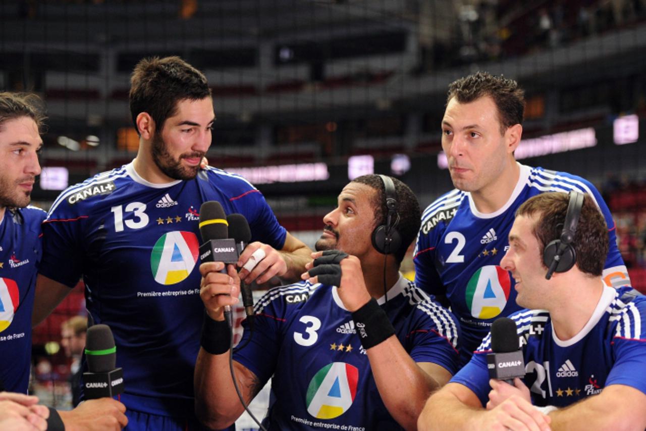 \'French players (From R) Michael Guigou, captain Jerome Fernandez, Didier Dinart, Nikola Karabatic and Bertrand Gille talk to the press after the 2011 Handball World Championship semifinal match Swed
