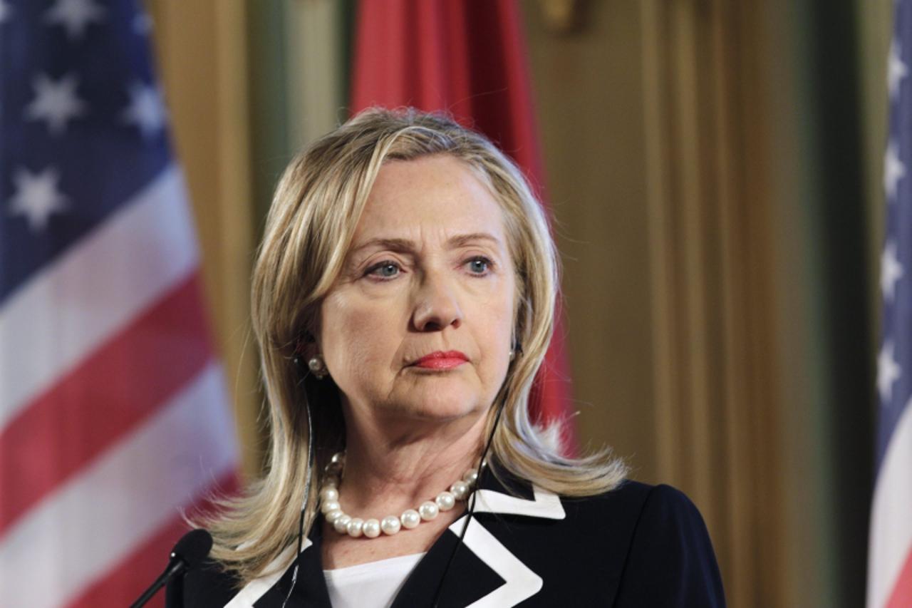 'U.S. State Secretary Hillary Clinton listens during a news conference in Riga June 28, 2012. Clinton is on one day visit to Latvia. REUTERS/Ints Kalnins (LATVIA - Tags: POLITICS)'