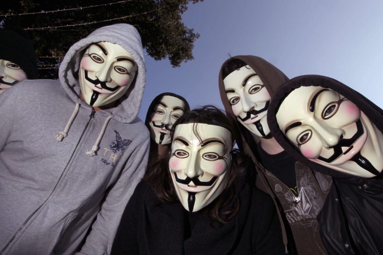 'Protesters wearing Anonymous Guy Fawkes masks pose during a demonstration against controversial Anti-Counterfeiting Trade Agreement (ACTA), on February 25, 2012 in Nice, southeastern France. AFP PHOT