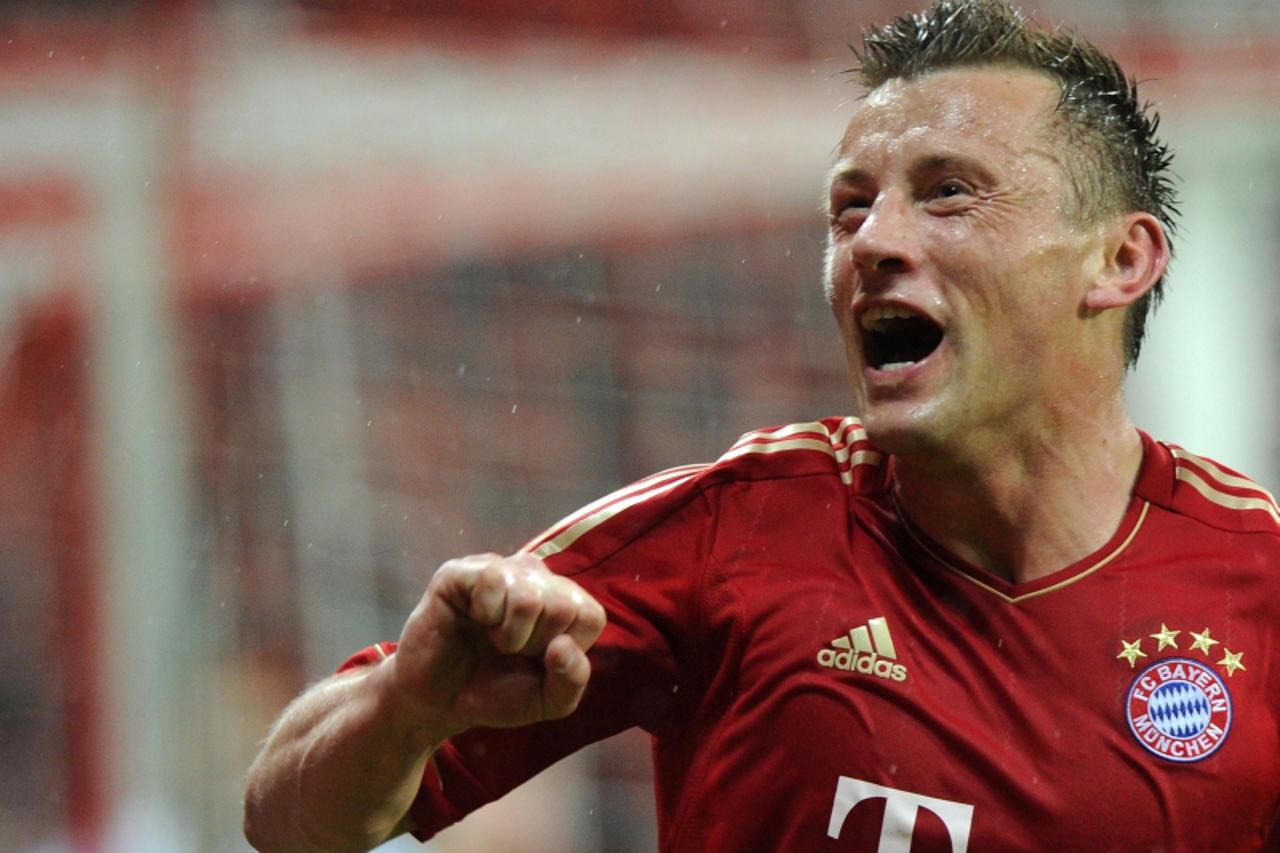 \'Bayern Munich\'s Croatian striker Ivica Olic celebrates scoring during the UEFA Champions League second leg quarter-final football match FC Bayern Munich vs Olympique de Marseille in Munich, souther