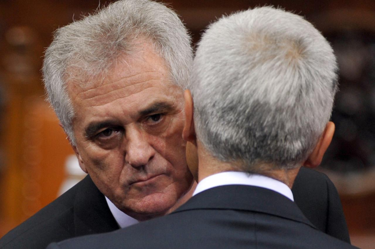 'The new Serbian President Tomislav Nikolic (L) kisses with former President Boris Tadic (R) as he took his oath of office  at the National Assembly building in Belgrade on May 31, 2012. Nikolic, swor