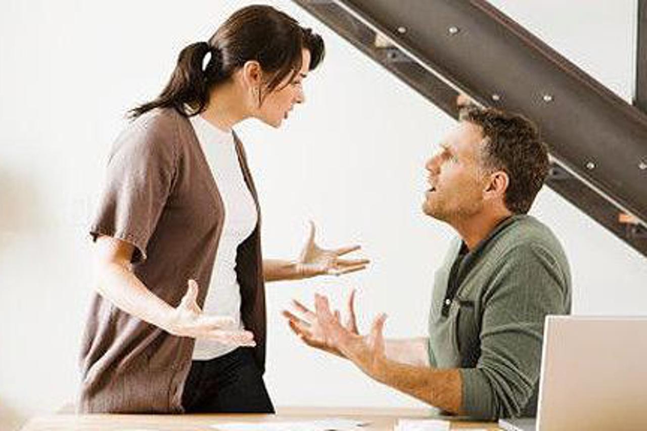 Couple arguing in dining room