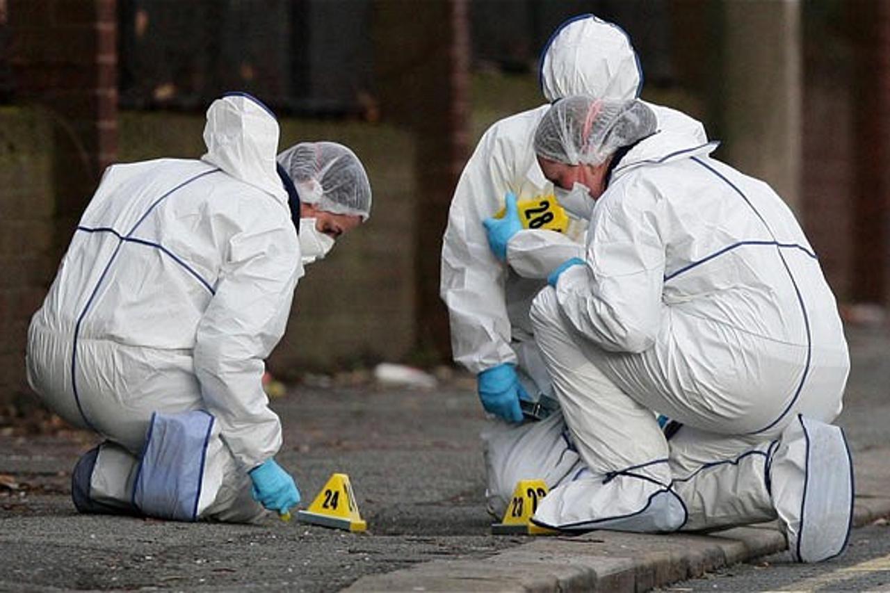 'Ordsall Lane shooting...Police forensic officers attend the scene in Ordsall Lane, in Salford, Greater Manchester, where a man in his 20s was shot dead in the street early today. PRESS ASSOCIATION Ph