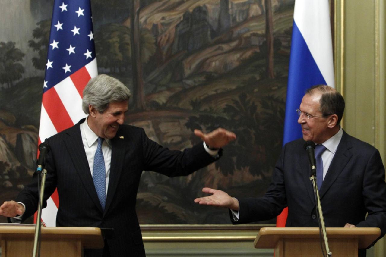 'Russia\'s Foreign Minister Sergei Lavrov (R) and U.S. Secretary of State John Kerry react during a joint news conference after their meeting in Moscow, May 7, 2013. The U.S. secretary of state sought