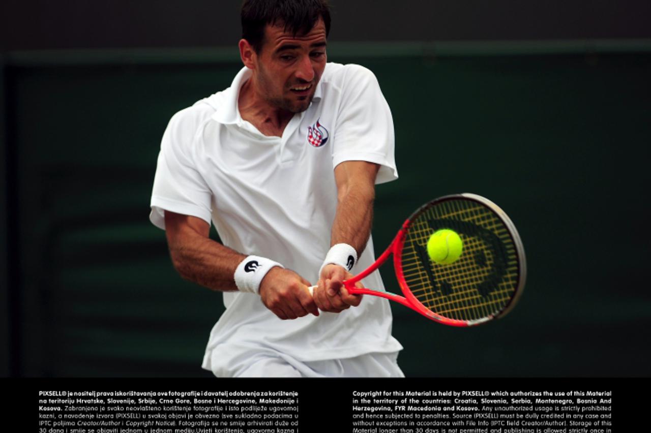 'Croatia's Ivan Dodig in action against Spain's David FerrerPhoto: Press Association/PIXSELL'