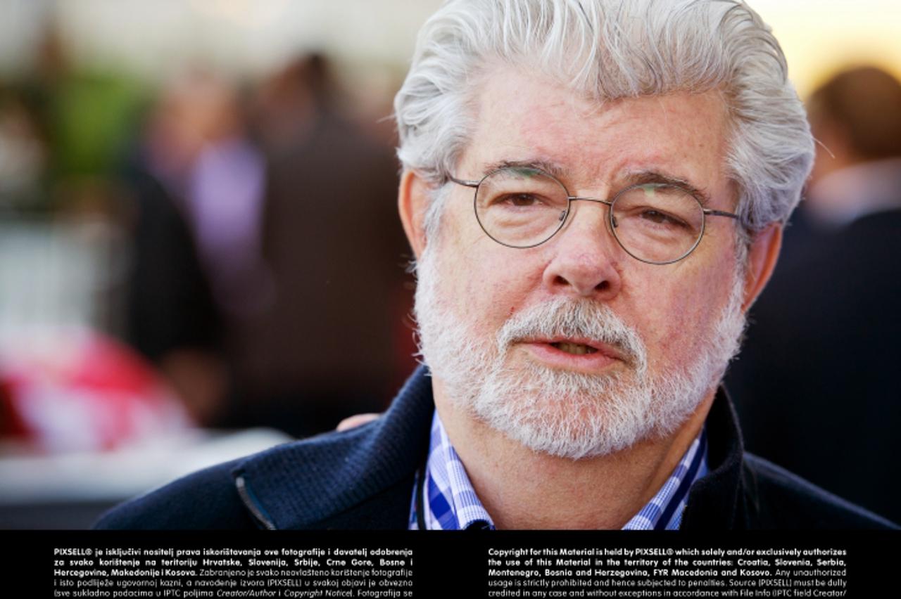 'US Film Producer George Lucas walks through the paddock at the Circuit of The Americas in Austin, Texas, USA, 17 November 2012. The Formula One United States Grand Prix will take place on 18 November