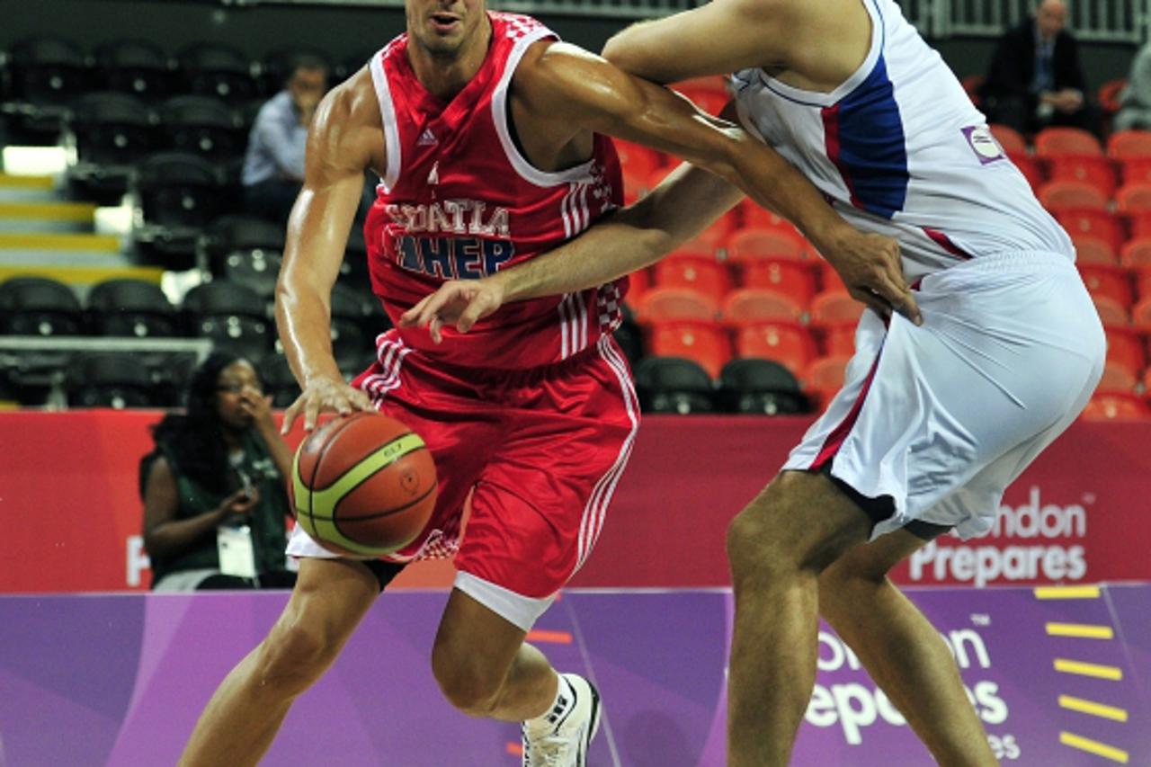 'Ante Tomic of Croatia (L) vies with Nenad Krstic of Serbia (R) during the London International Basketball Invitational, part of the London Prepares series at the Olympic Park, Stratford in London on 