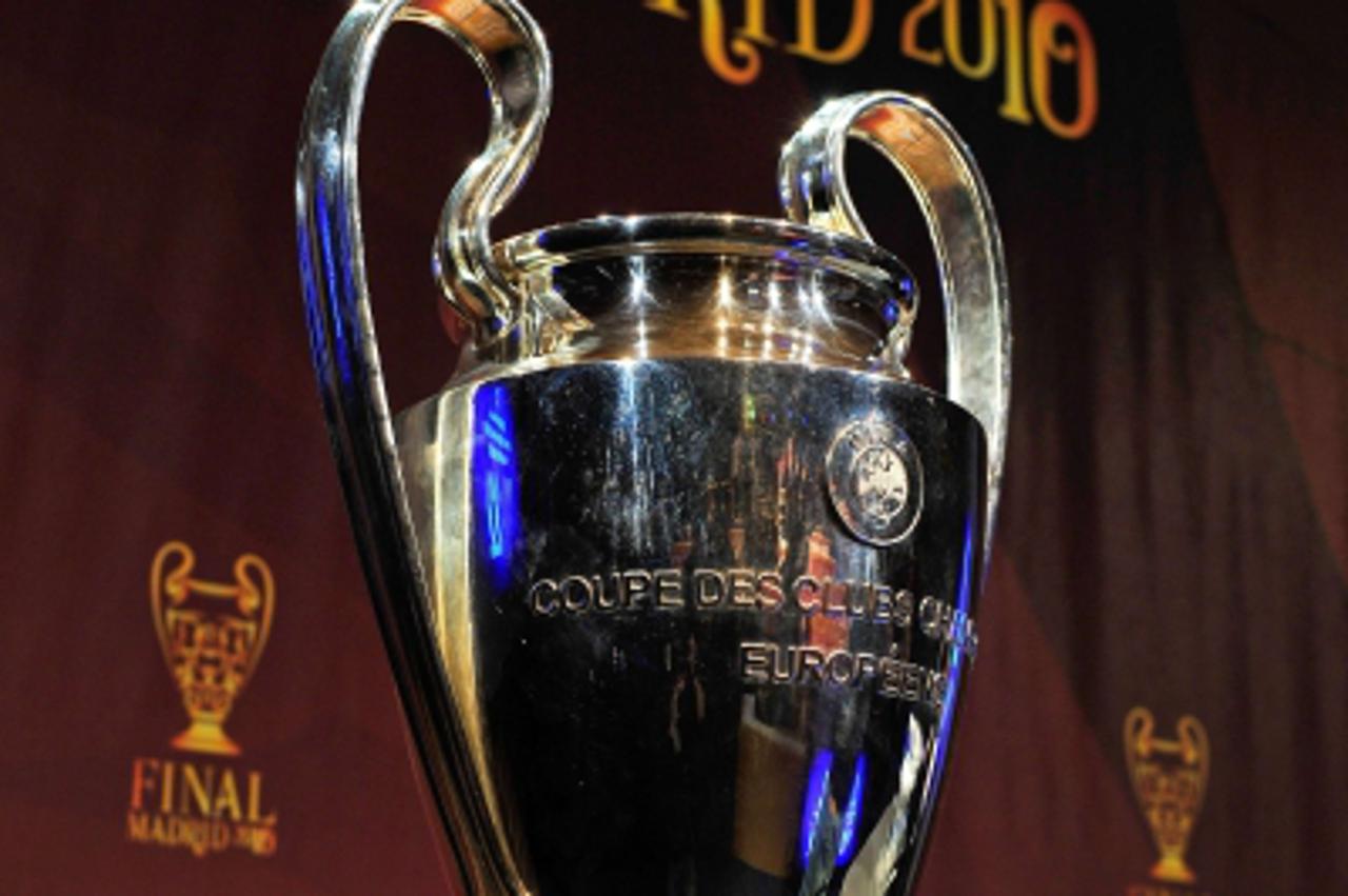 'The UEFA Champions League trophy is displayed prior to the draw of the UEFA Champions League quarter-finals at the UEFA headquarters on March 19, 2010 in Nyon. Arsenal face Barcelona in the Champions