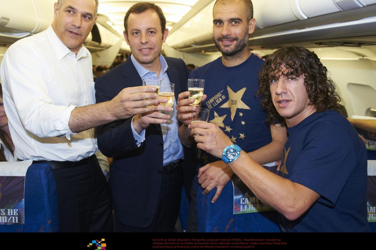 '11.05.2011, Primera Division, UD Levante - FC Barcelona  v.l. Andoni Zubiarreta (Sport Director), Sandro Rosell (President FC Barcelona), Pep Guardiola Head Coach (FC Barcelona), Carles Puyol (FC Bar