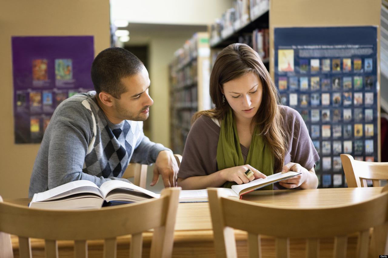 Couple studying in library
