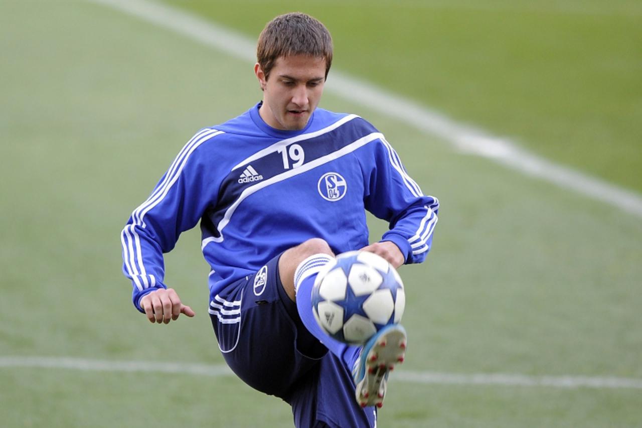 'German football team Schalke\'s Italian player Mario Gavranovic warms up during a training session at Mestalla Stadium on February 14, 2011 on the eve of the team\'s Champions League football match a