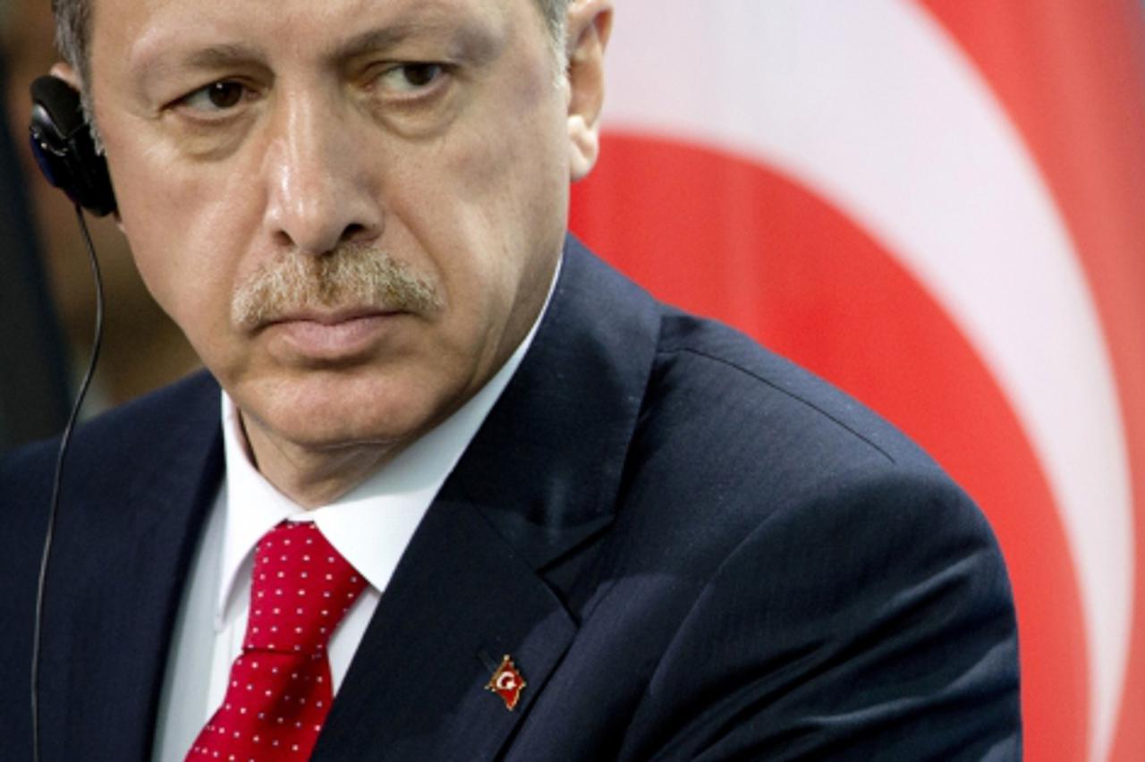 'Turkish Prime Minister Recep Tayyip Erdogan addresses a press conference after meeting for talks with the German chancellor at the chancellery in Berlin on October 31, 2012. The talks focused on the 