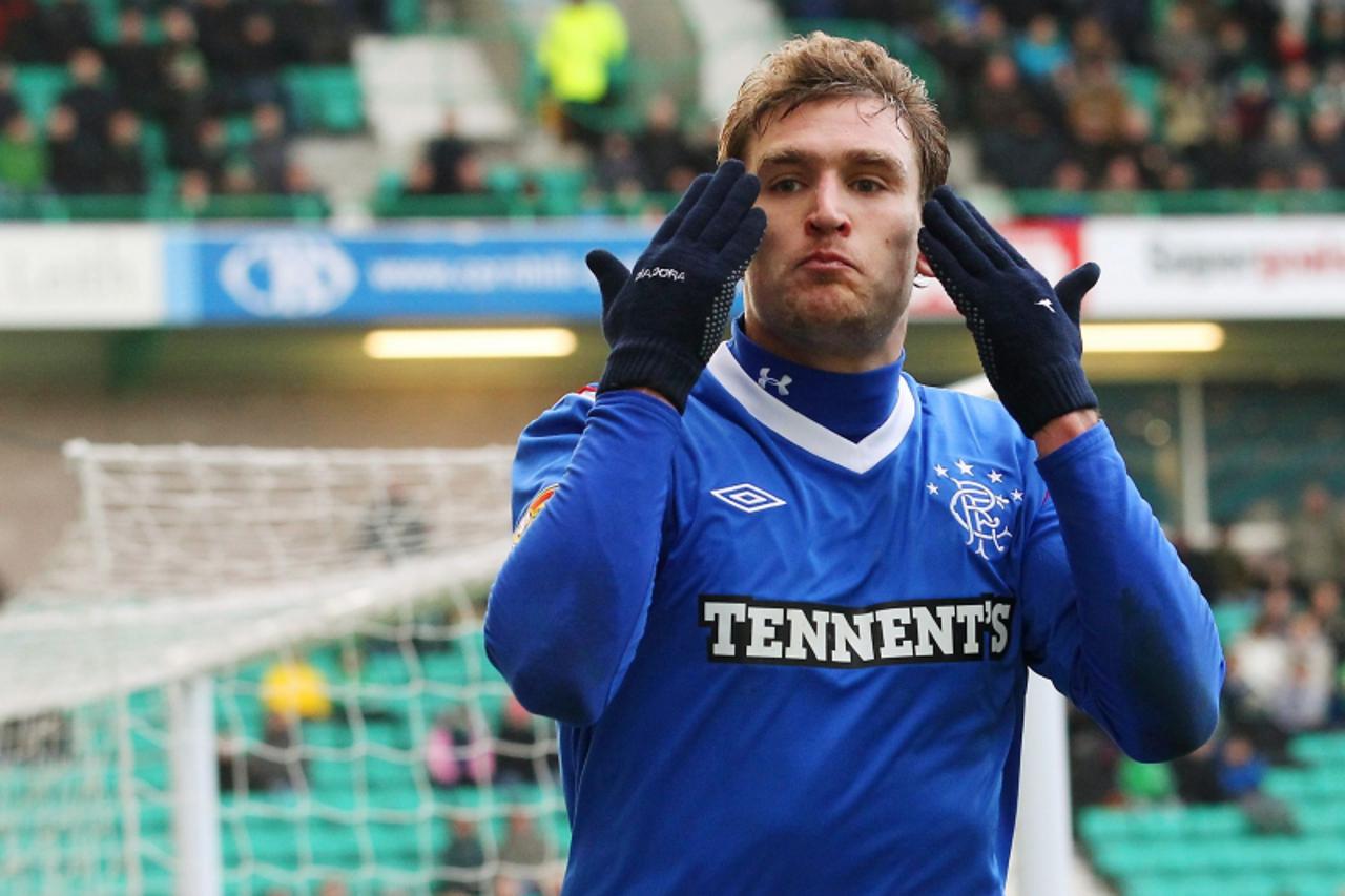 \'Rangers\' Nikica Jelavic celebrates scoring his second goal against Hibernian during their Scottish Premier League soccer match in Edinburgh, Scotland December 10, 2011. REUTERS/David Moir (BRITAIN 