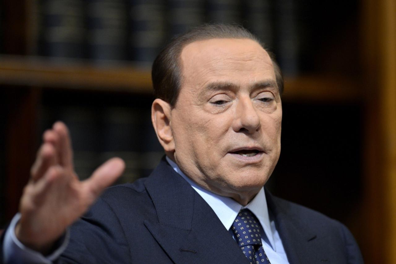 'Former Italian Prime Minister Silvio Berlusconi speaks during a press conference on May 25, 2012 at the senate in Rome. Berlusconi suggested during a press conference with the secretary general of th