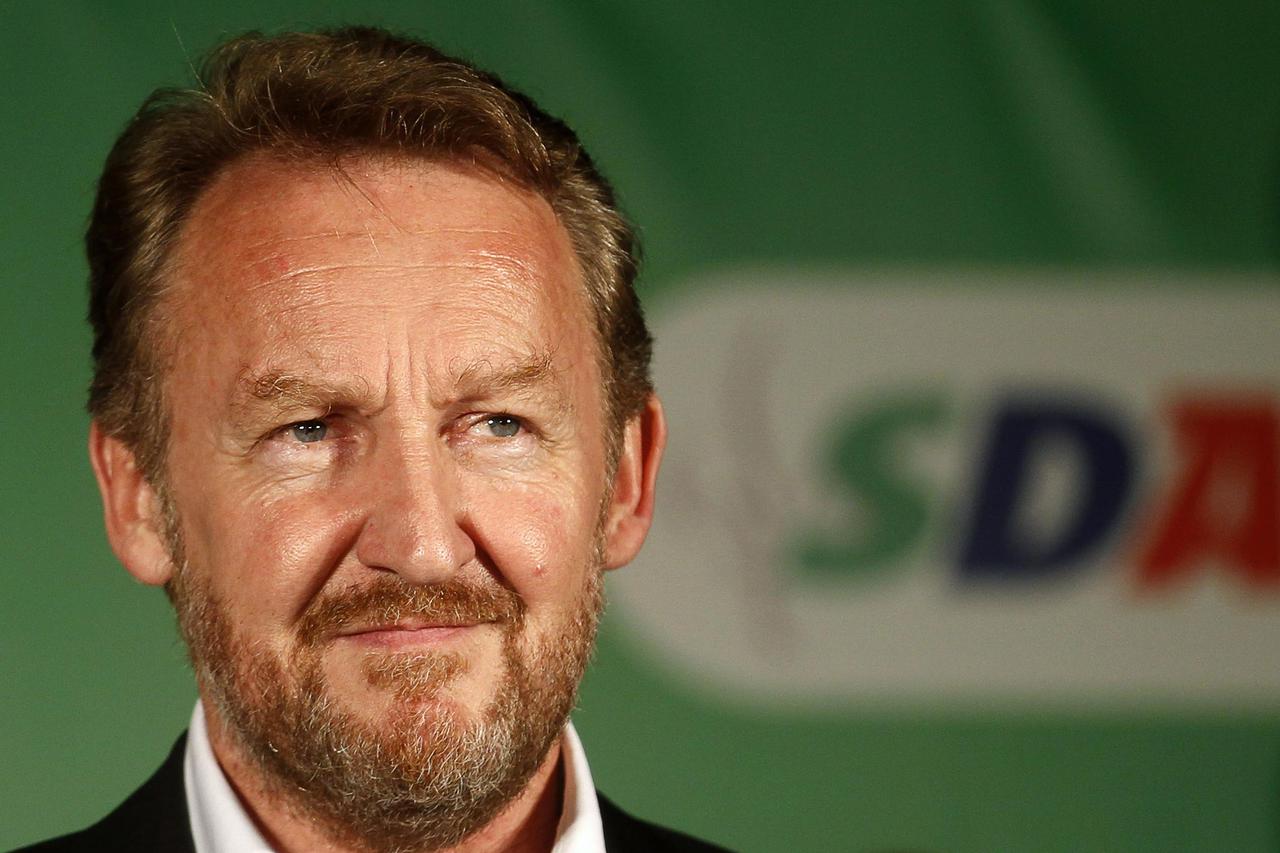 REFILE - CLARIFYING CAPTION   Bakir Izetbegovic of the Party of Democratic Action (SDA) attends a news conference in Sarajevo October 13, 2014. Izetbegovic during the news conference declared himself the winner of the Bosniak (Muslim) seat of the Tri-part