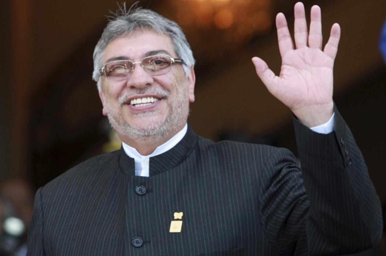 'Paraguay's President Fernando Lugo gestures after arriving to participate in the Mercosur trade block summit in Montevideo December 20, 2011. Uruguay is hosting a two-day Mercosur trade summit invol