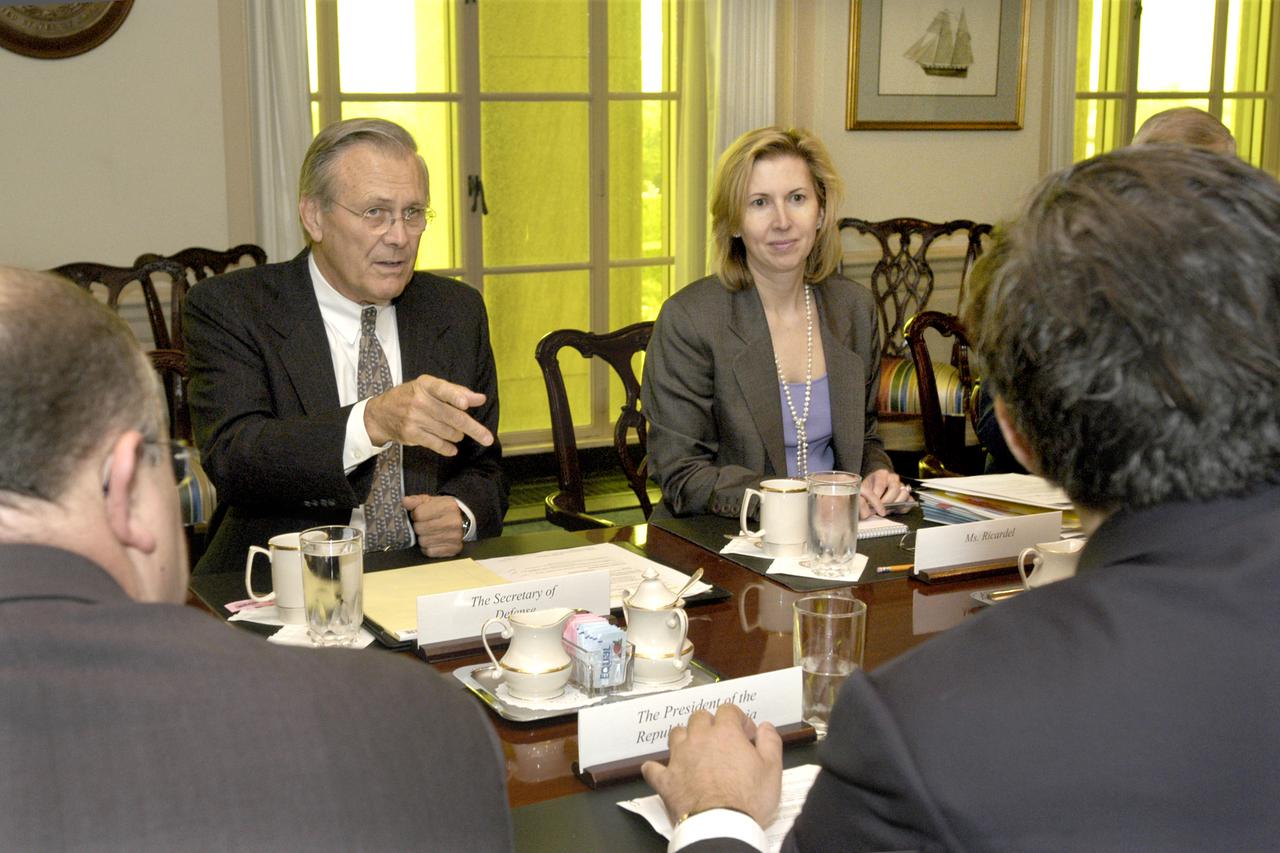 040804-D-9880W-036       Secretary of Defense Donald H. Rumsfeld (2nd from left) discusses regional security issues with Georgian President Misha Saakashvili (right foreground) in the Pentagon on Aug. 4, 2004.  Accompanying Saakashvili is the Deputy Chief