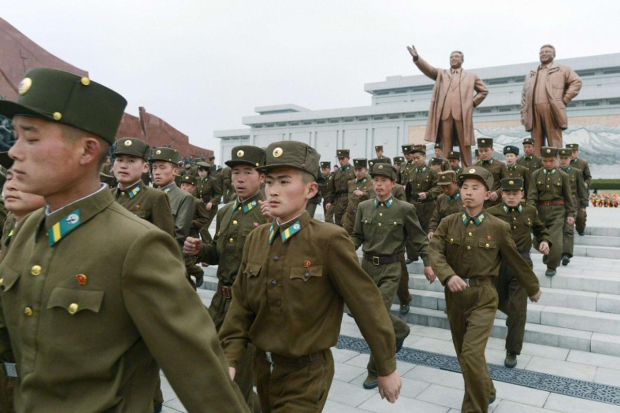 'North Korean soldiers visit the bronze statues of North Korea founder Kim Il-sung (L) and late leader Kim Jong-il at Mansudae in Pyongyang, in this photo taken and provided by Kyodo April 15, 2013, t