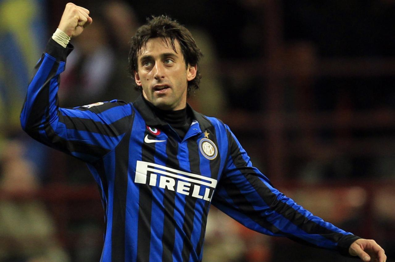 'Inter Milan\'s Diego Milito celebrates after scoring against Parma during their Serie A soccer match at San Siro stadium in Milan January 7, 2012.  REUTERS/Stefano Rellandini  (ITALY - Tags: SPORT SO