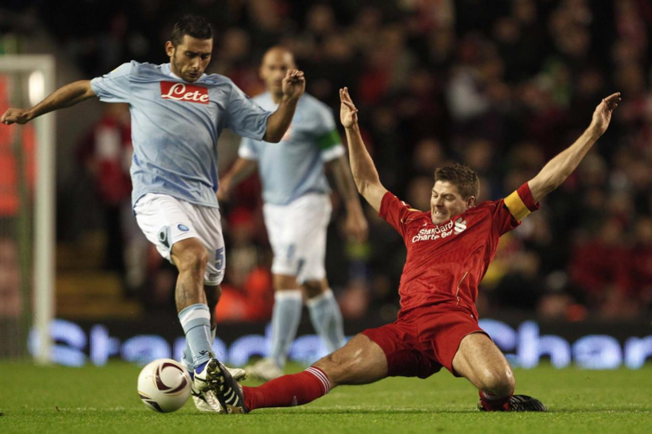 \'Liverpool\'s Steven Gerrard (R) challenges Napoli\'s Micele Pazienza during their Europa League soccer match at Anfield in Liverpool, northern England, November 4, 2010. REUTERS/Phil Noble (BRITAIN 
