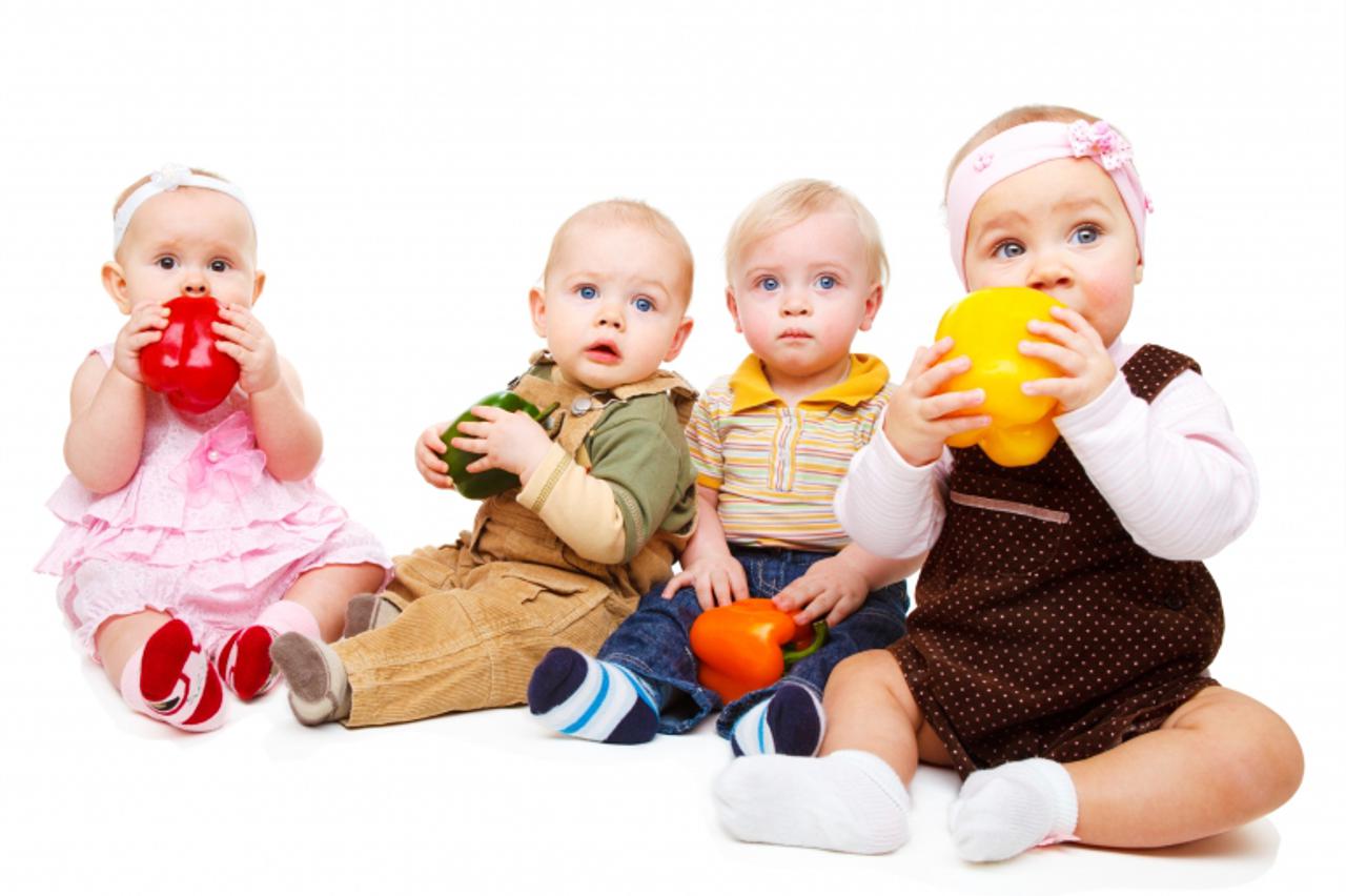 'Babies group holding  peppers'