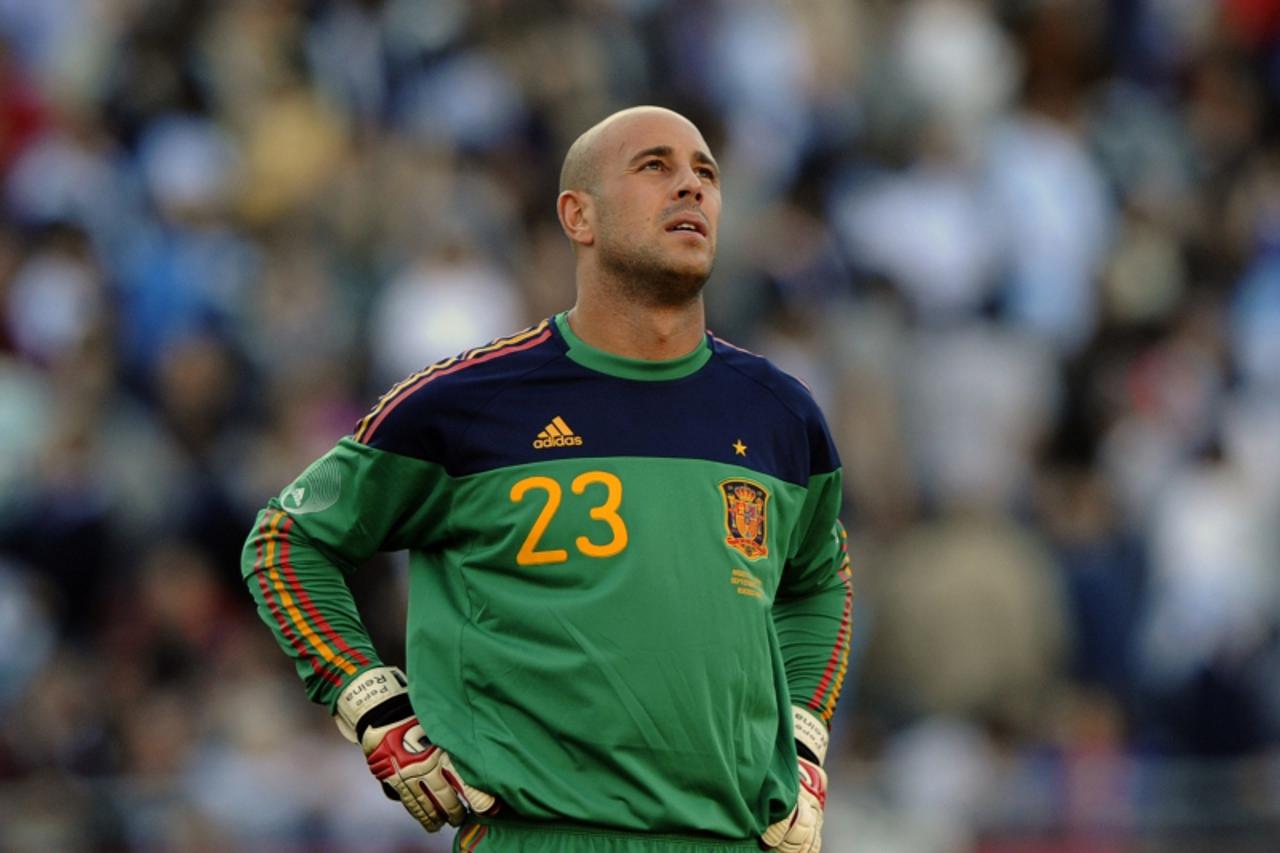 'Spain's goalkeeper Pepe Reina reacts after being failing to avoid the third goal from Argentina by forward Carlos Tevez, during their friendly football match at the Monumental stadium in Buenos Aire