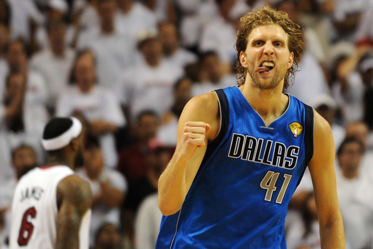 'BKN-SPORTS-YEAR-2011 Dirk Nowitzki of the Dallas Mavericks celebrates a point against the Miami Heat in Game 6 of  the NBA Finals on June 12, 2011 at the AmericanAirlines Arena in Miami, Florida.  Ja