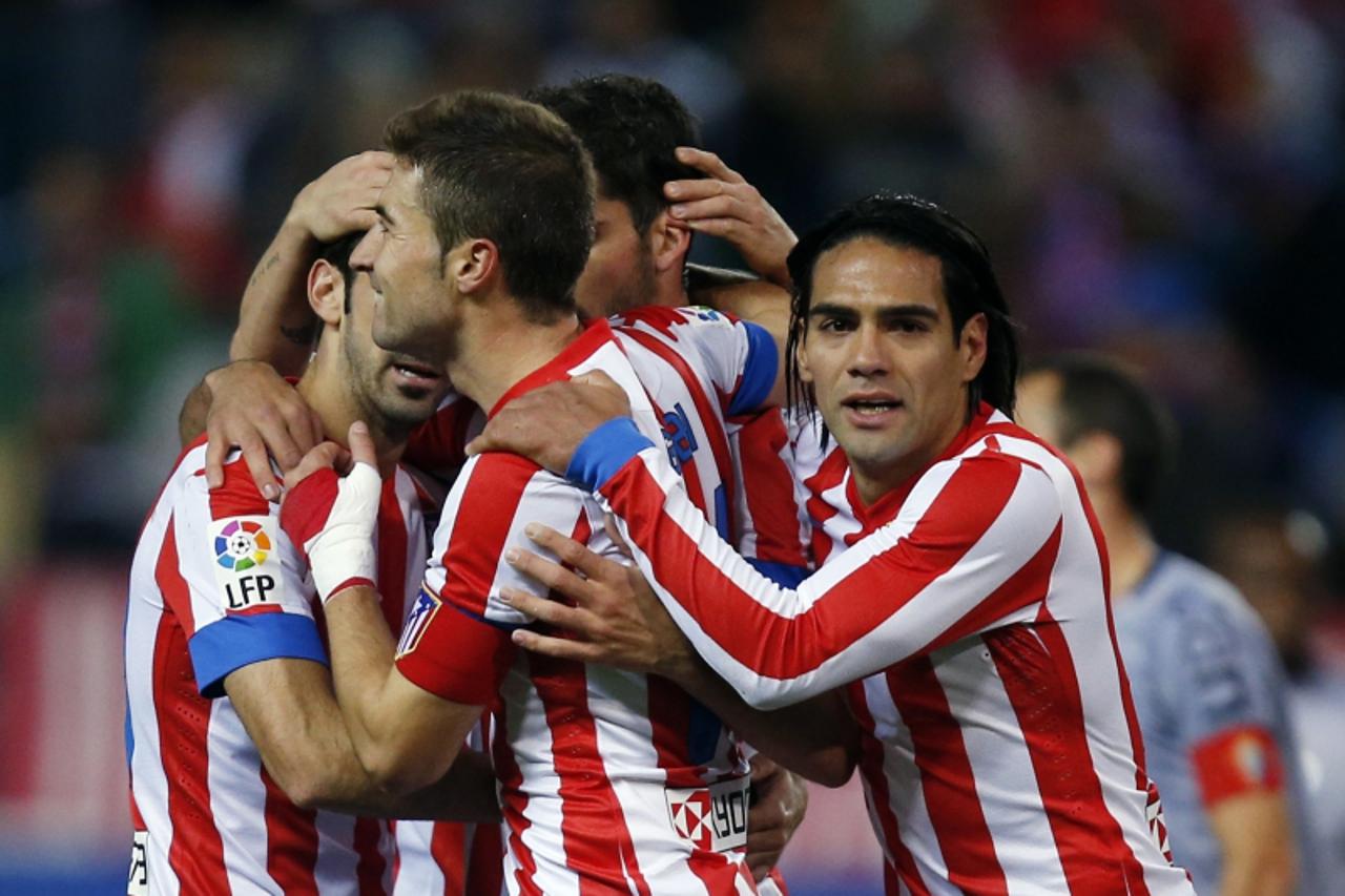 'Atletico Madrid's Radamel Falcao (R) celebrates his team's second goal against Osasuna during their Spanish first division soccer match at Vicente Calderon stadium in Madrid October 28, 2012.  REUT