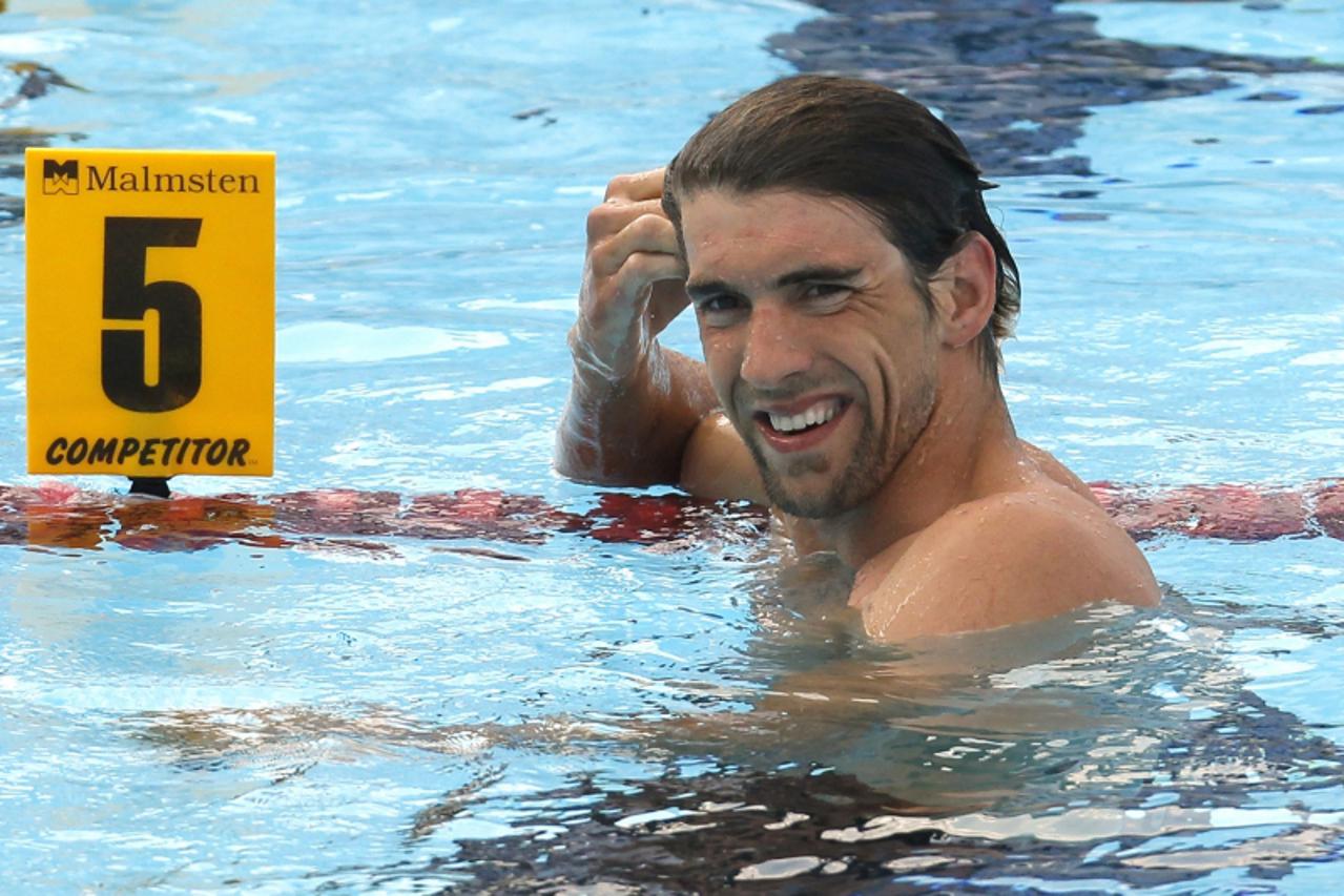 'U.S. swimmer Michael Phelps reacts after winning the men\'s 200 metres medley final at the Paris Open swimming competition June 27, 2010. REUTERS/Benoit Tessier (FRANCE - Tags: SPORT SWIMMING)'