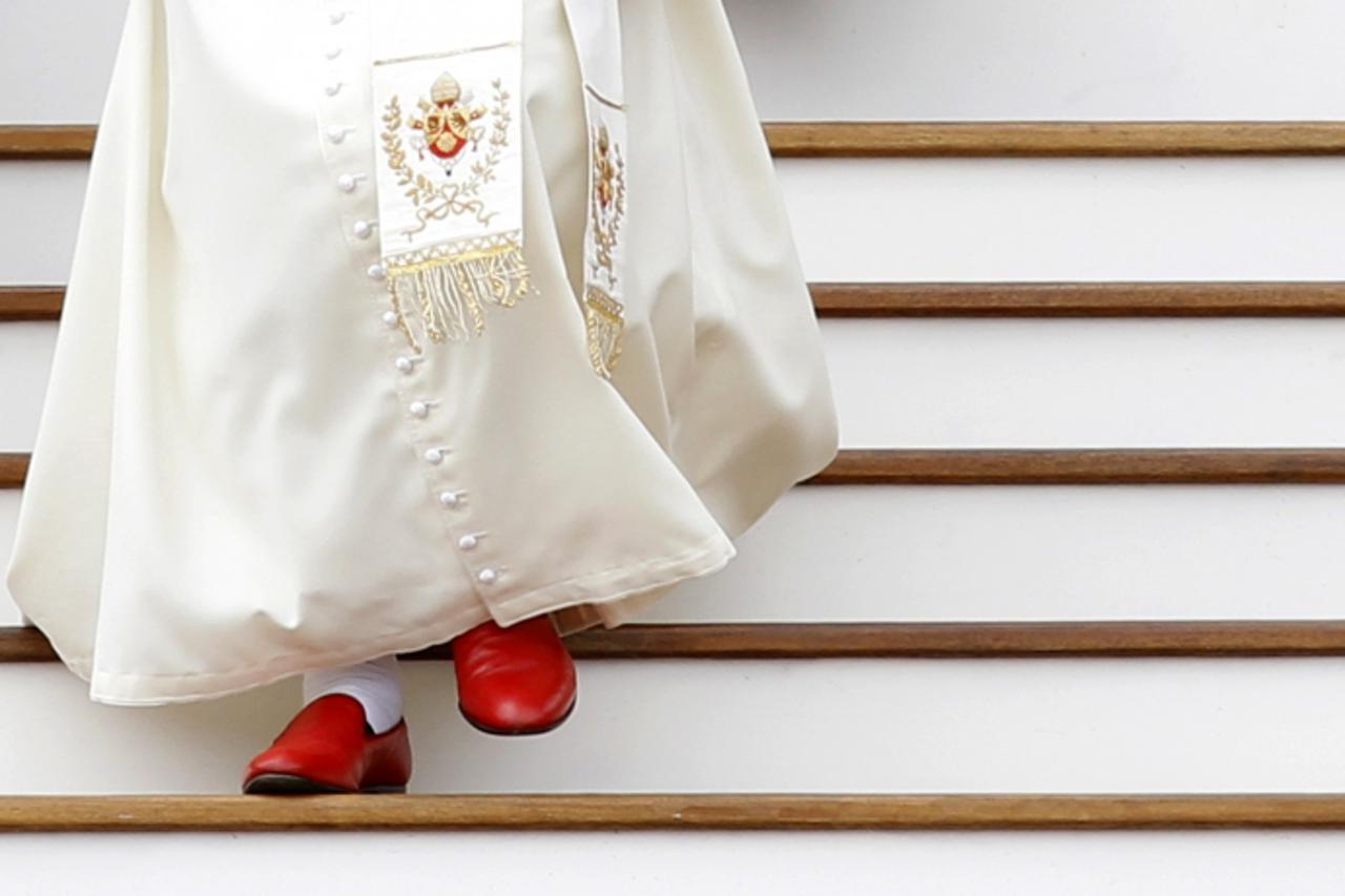 'Pope Benedict XVI leaves at the end of his weekly general audience in St. Peter\'s Square at the Vatican in this May 19, 2010 file photo. Pope Benedict said on February 11, 2013 he will resign on Feb