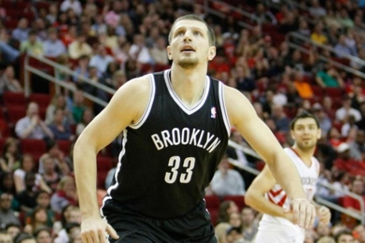'Jan 26, 2013; Houston, TX, USA; Brooklyn Nets power forward Mirza Teletovic (33) rebounds against the Houston Rockets in the fourth quarter at the Toyota Center. The Rockets defeated the Nets 119-106