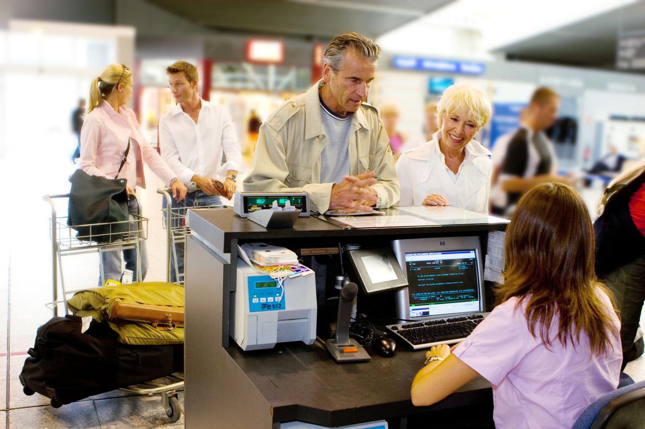 Senior couple at check in counter at airport, Image: 6097335, License: Rights-managed, Restrictions: , Model Release: yes, Credit line: Profimedia, Alexandre Jacques