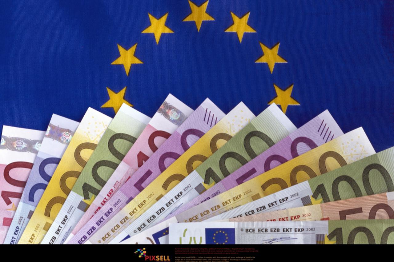 'A range of fanned-out Euro-banknotes (Ten-, twenty-, fifty-, hundred-, two hundred- and five hundred-euro notes) of the European Union lies on a blue background with yellow stars. Photo taken in 2006