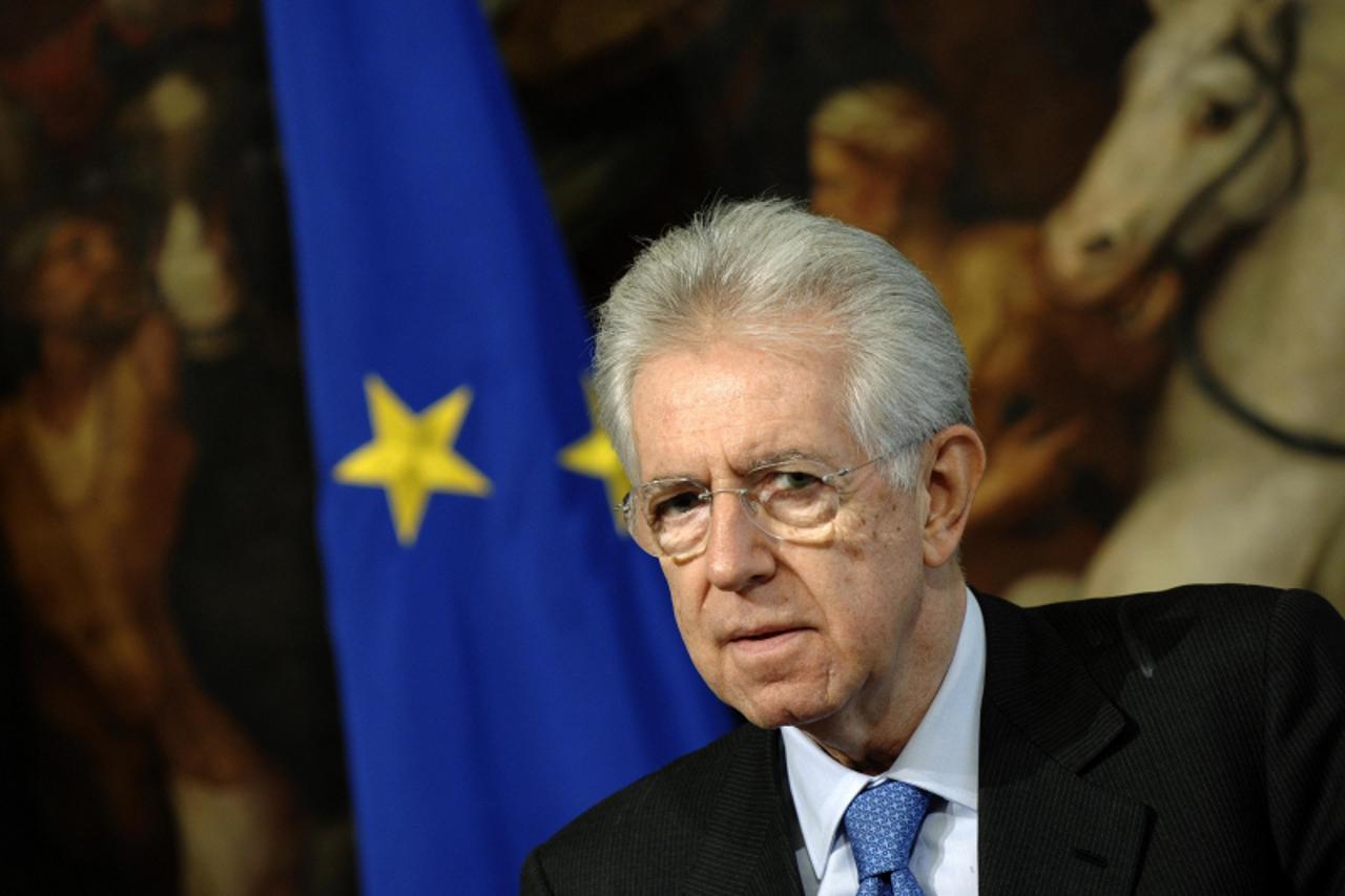 'Italian Prime Minister Mario Monti looks on during a meeting with Secretary General of the Organization for Economic Cooperation and Development Angel Gurria at Chigi palace in Rome February 6, 2012.