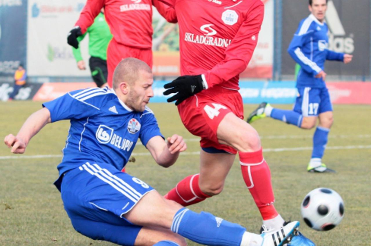 '26.02.2011., Koprivnica - Nogometna utakmica 19. kola Prve HNL izmedju NK Slaven Belupo i RNK Split. Na fotografiji: plavi Aljosa Vojnovic i Ivica Krizanac. Photo: Marijan Susenj'