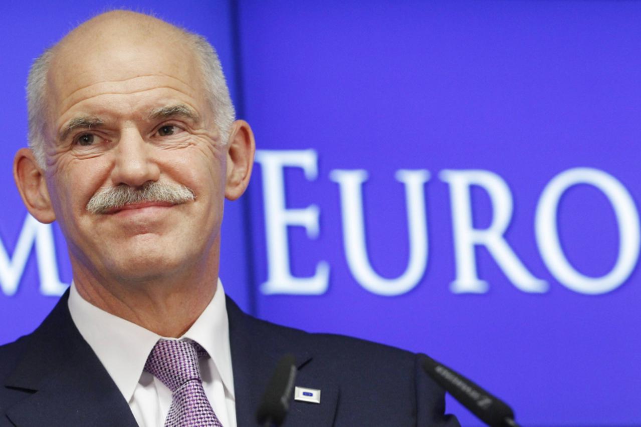 'Greece\'s Prime Minister George Papandreou talks to media during a news conference at the end of an euro zone leaders crisis summit in Brussels July 21, 2011. REUTERS/Thierry Roge (BELGIUM - Tags: PO