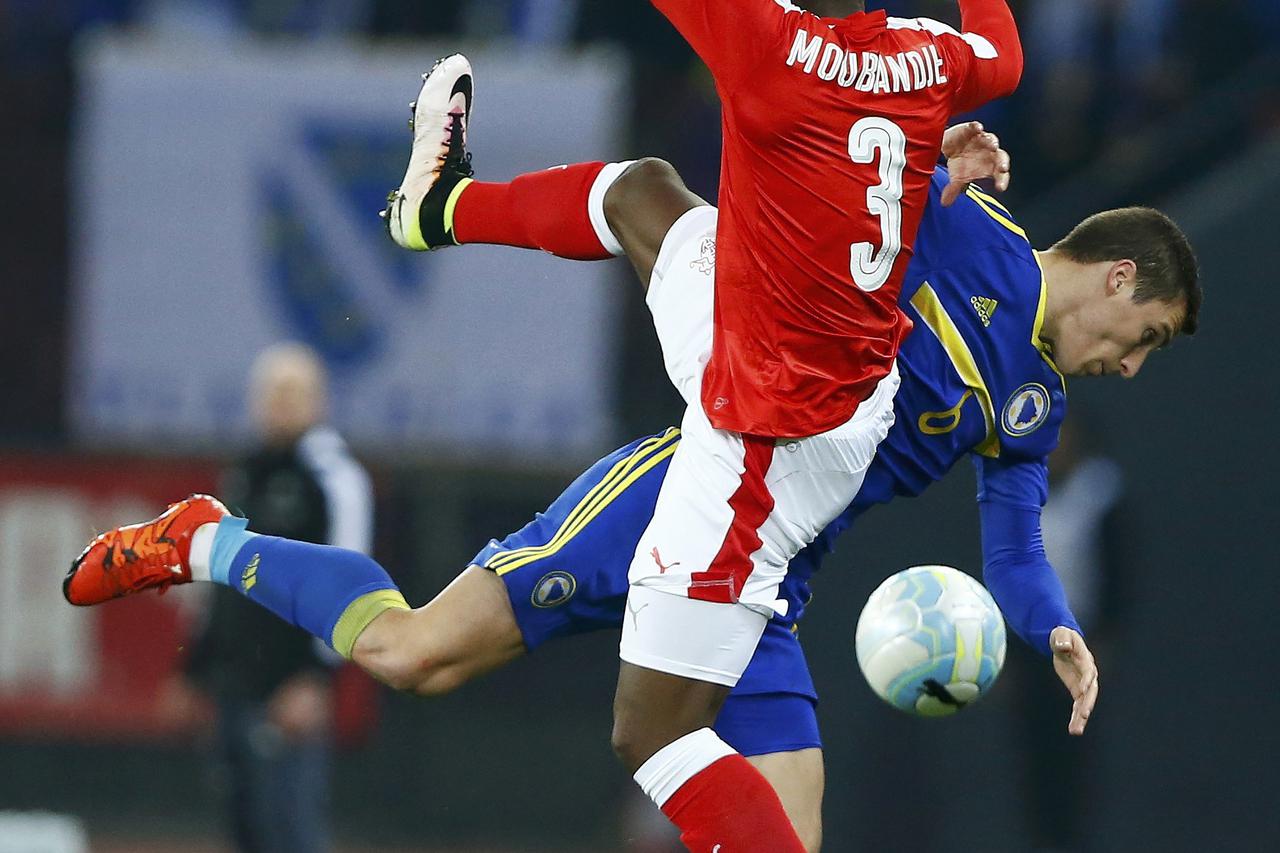 Football Soccer - Switzerland v Bosnia and Herzegovina - International Friendly - Letzigrund Stadium, Zurich, Switzerland - 29/03/16 Switzerland's J-Francois Moubandje and Bosnia and Herzegovina's Ognjen Vranjes in action REUTERS/Arnd Wiegmann