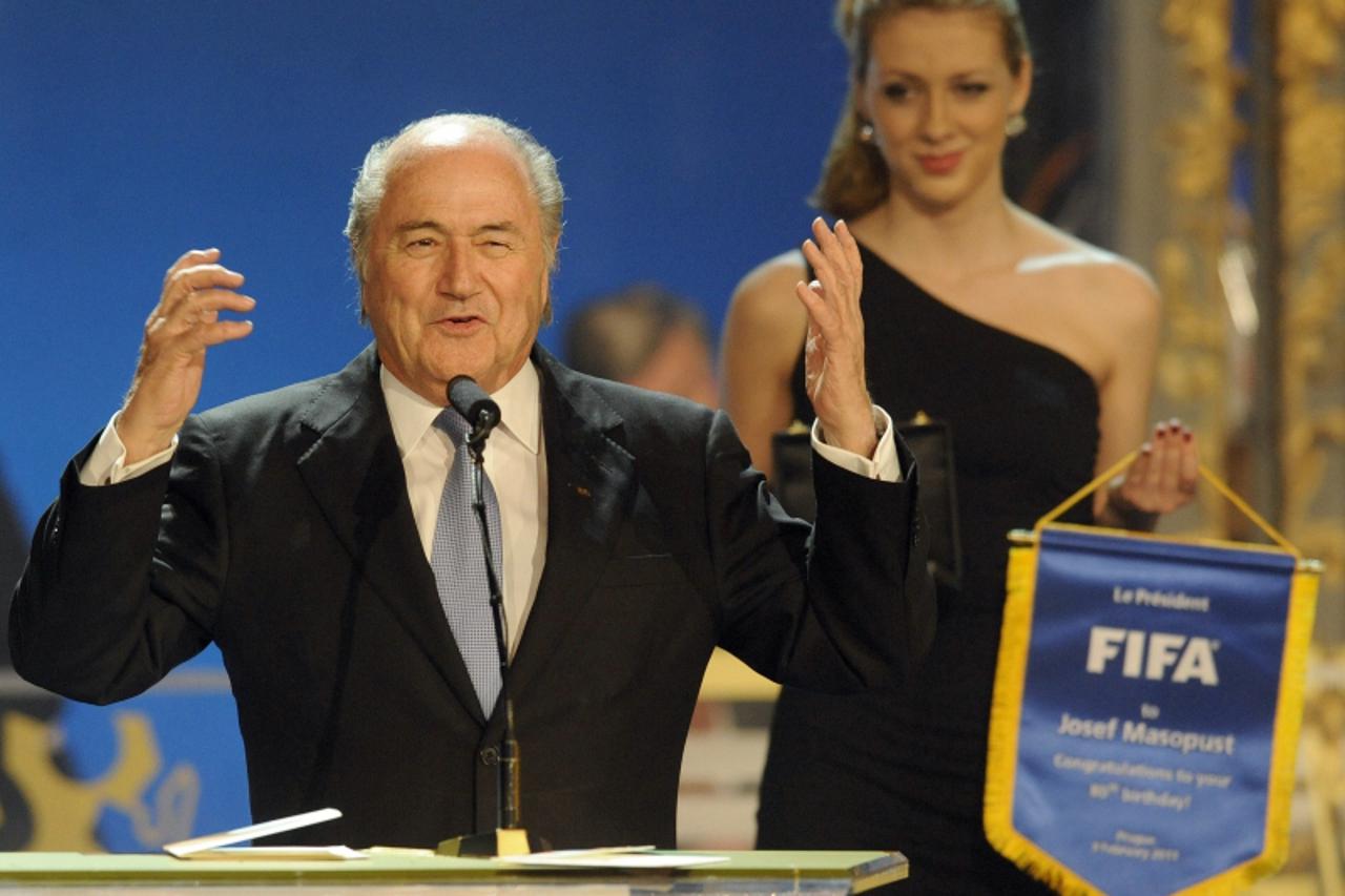 'FIFA President Sepp Blatter gestures on the stage during the Czech Republic\'s Football Player of the Year 2010 award ceremony on February 7, 2011 in Prague as he congratulates Czech legendary midfie