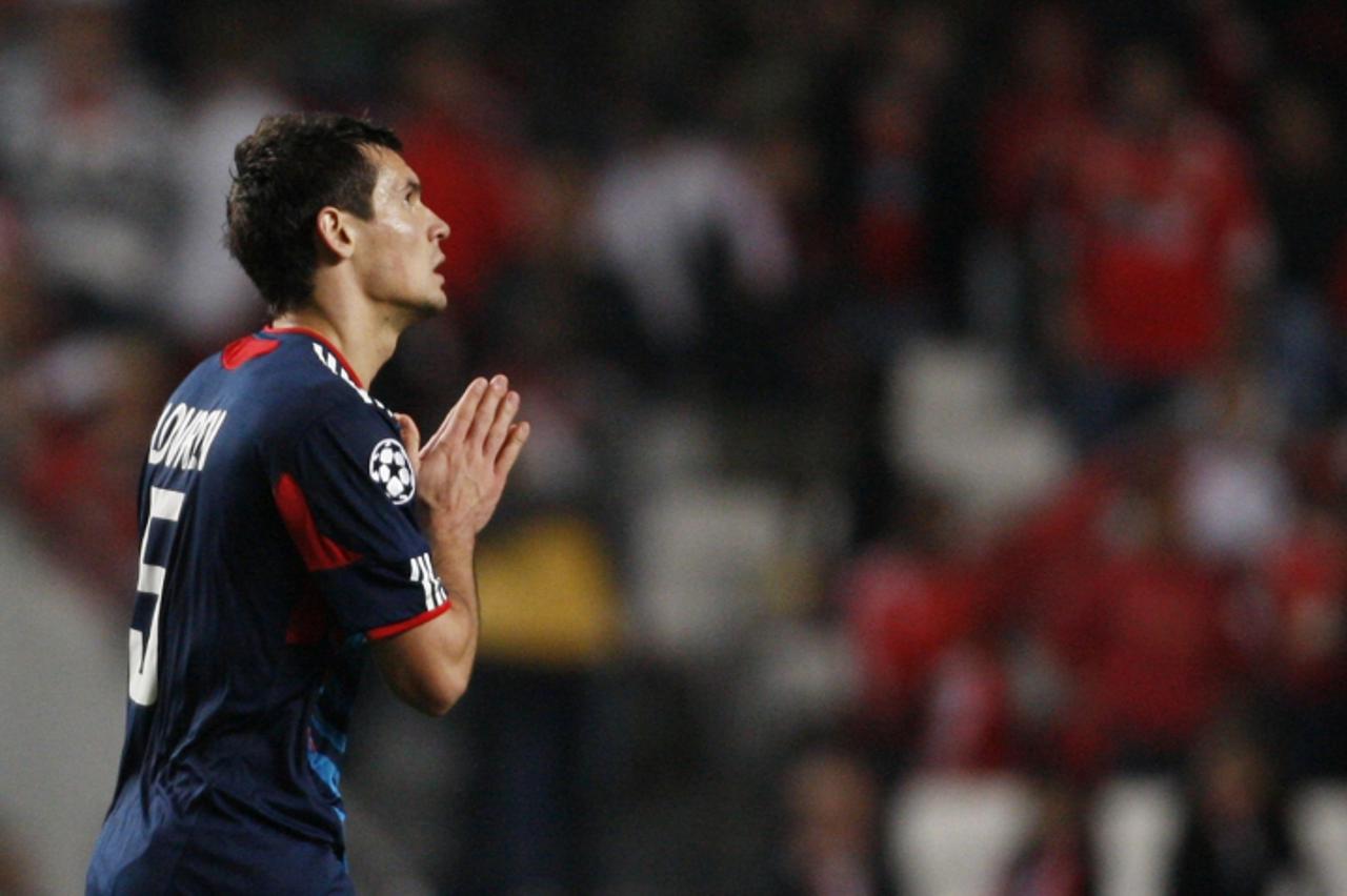 \'Olympique Lyon\'s Dejan Lovren celebrates his goal against Benfica during their Champions League Group B soccer match at Luz stadium in Lisbon November 2, 2010.   REUTERS/Hugo Correia (PORTUGAL - Ta